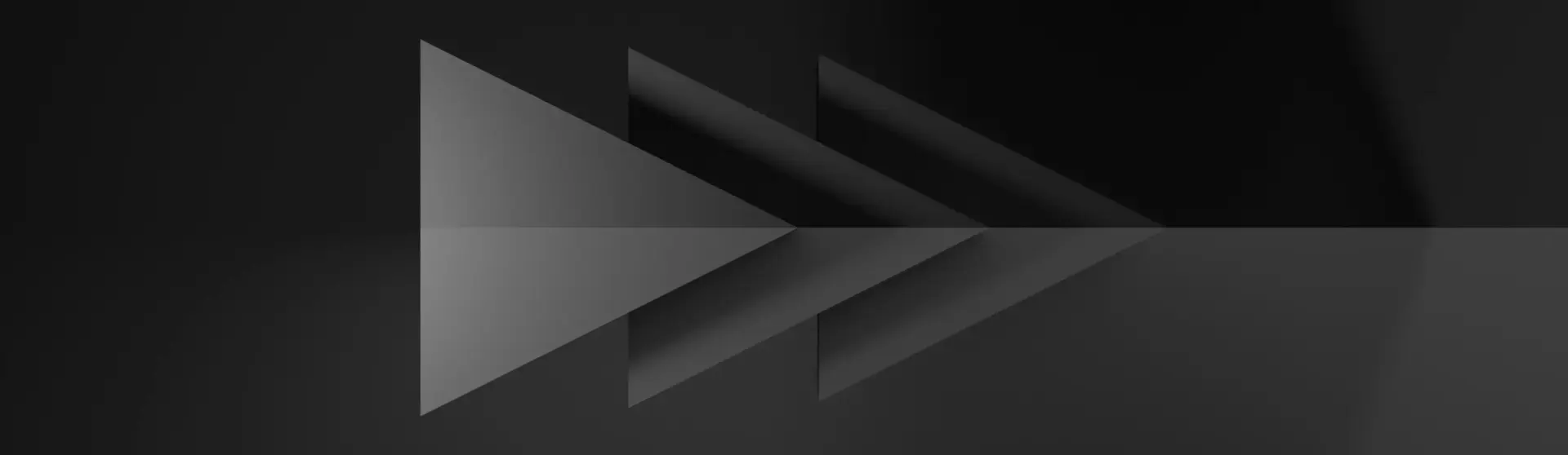 Des triangles noirs superposés sur un fond gris dont le sommet est orienté vers la droite